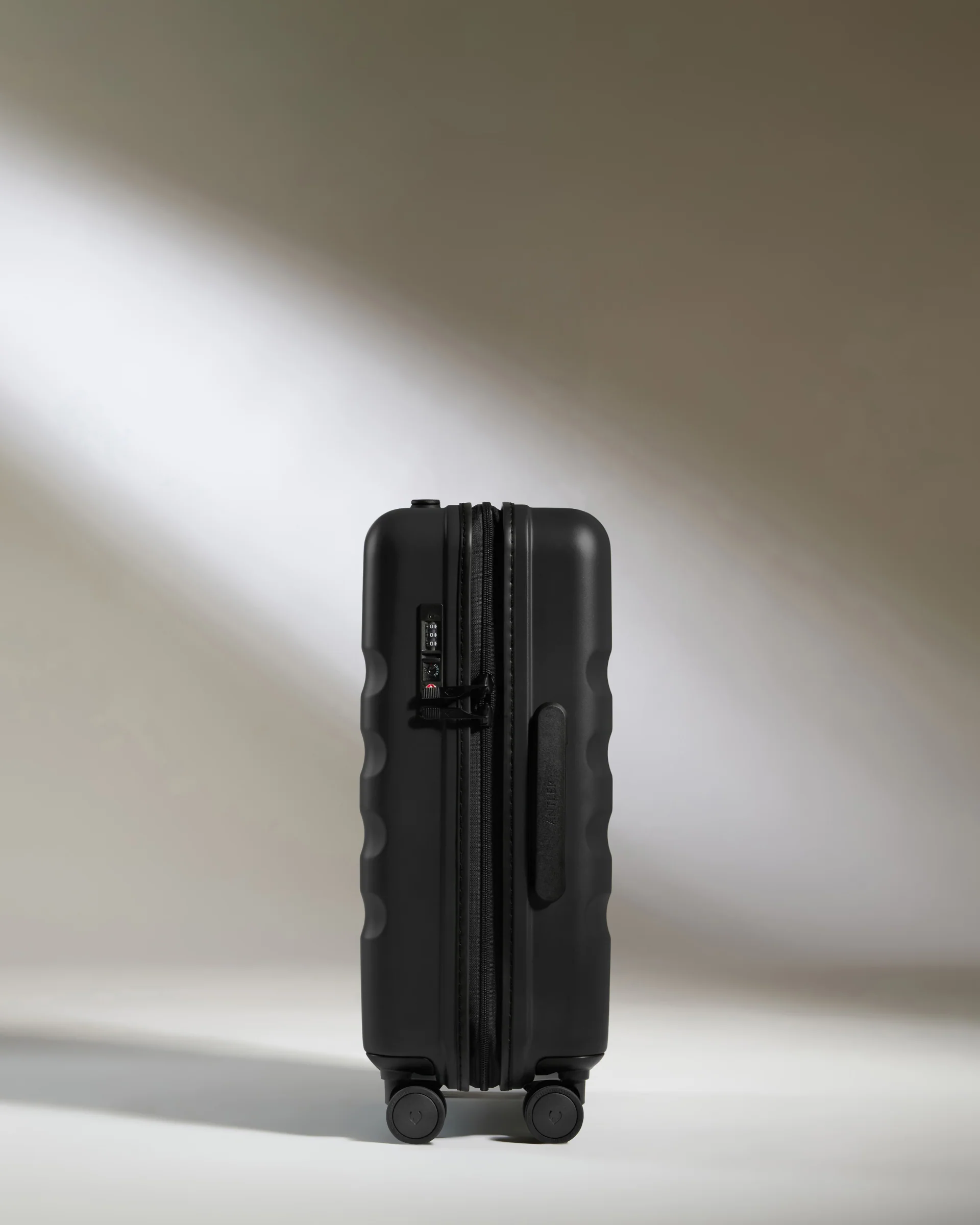 Cabin Suitcase in Black - Icon Stripe - Image 4